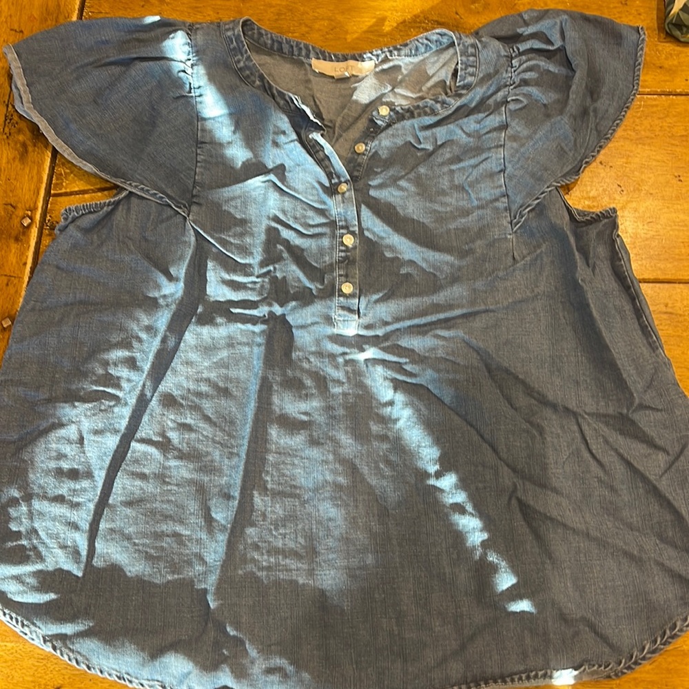 Denim top with ruffle sleeve.NWOT.